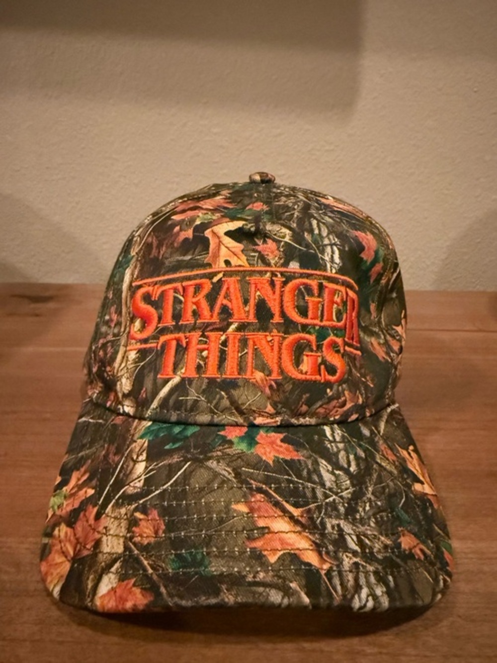 Stranger Things hard to find bright orange and camo embroidered SnapBack hat